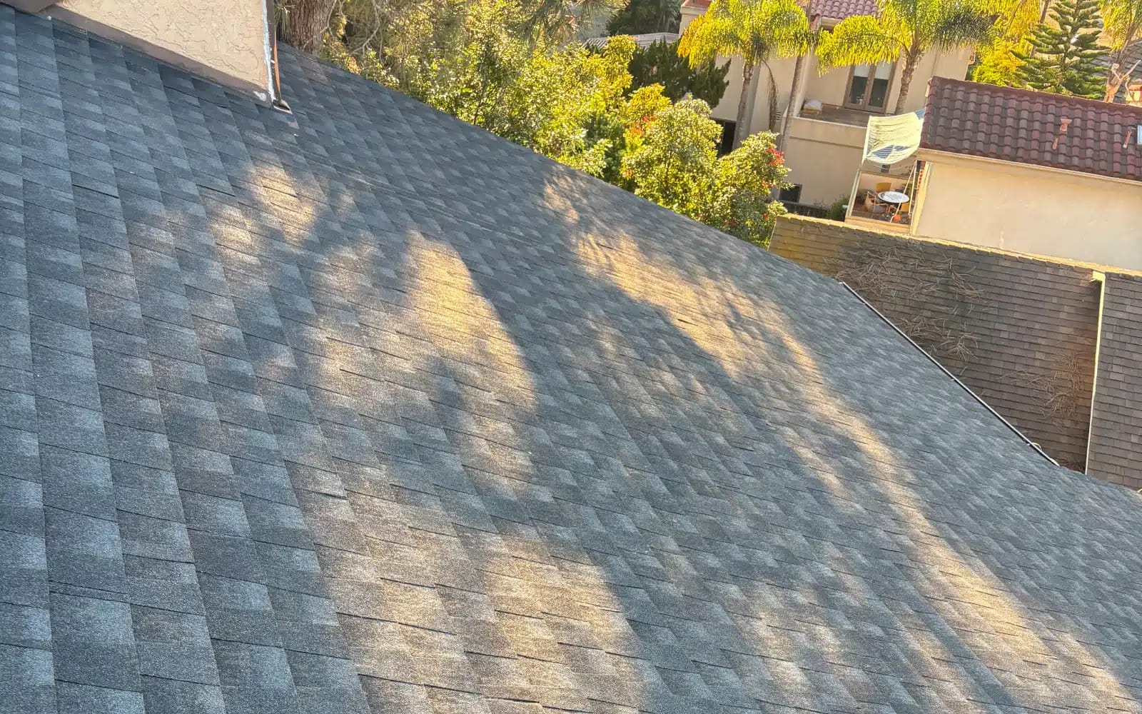 Completed asphalt shingle roof replacement in Del Mar, California featuring GAF Timberline HDZ shingles with a uniform finished appearance.
