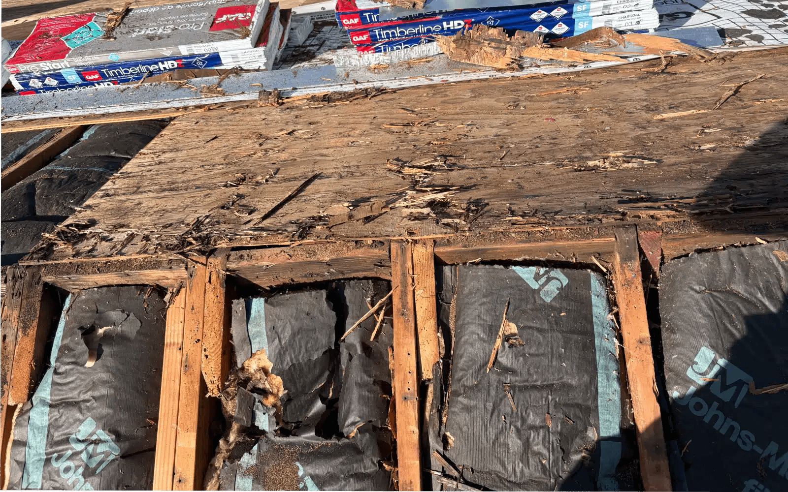 Deteriorated roof decking and underlayment uncovered during inspection prior to roof replacement in Del Mar, California.