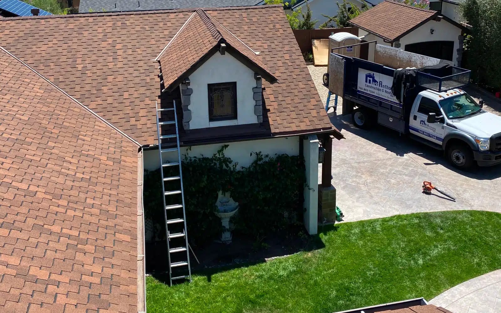 Finished asphalt shingle roof replacement in Encinitas, CA featuring GAF Grand Sequoia shingles and completed installation by Mark Anthony Construction & Roofing.