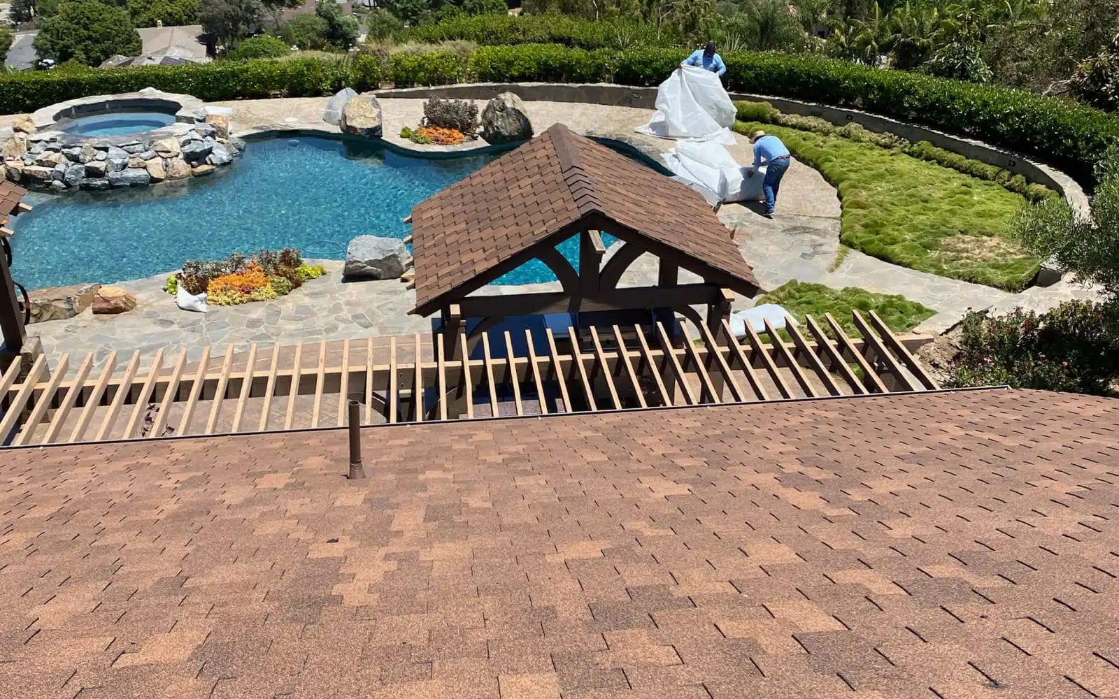 Aerial view of completed asphalt shingle roof replacement in Encinitas, CA with GAF Grand Sequoia shingles and restored long-term roofing performance.