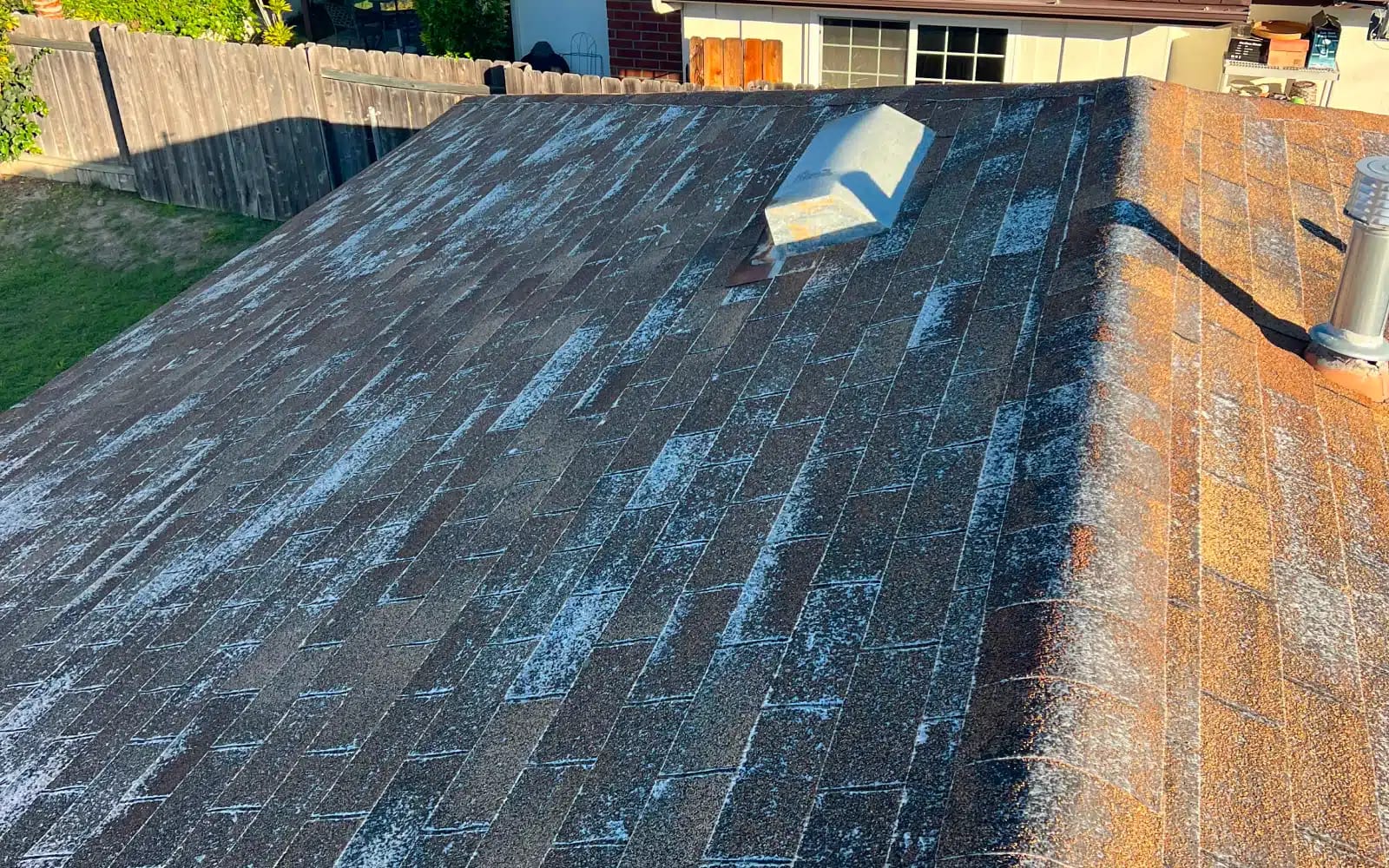 Failing asphalt shingle roof in San Carlos, San Diego, CA with exposed fiberglass and surface deterioration prior to full cool roof replacement.