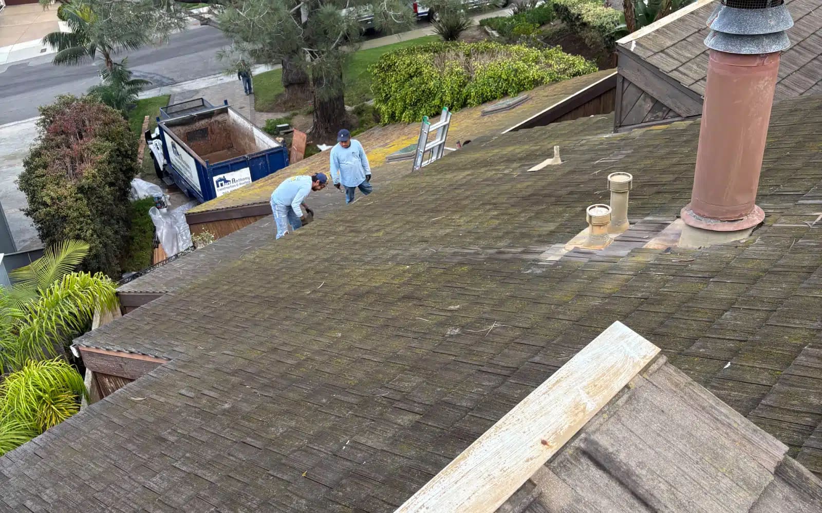 Failing lightweight concrete tile roof prior to asphalt shingle roof replacement in Del Mar, California.