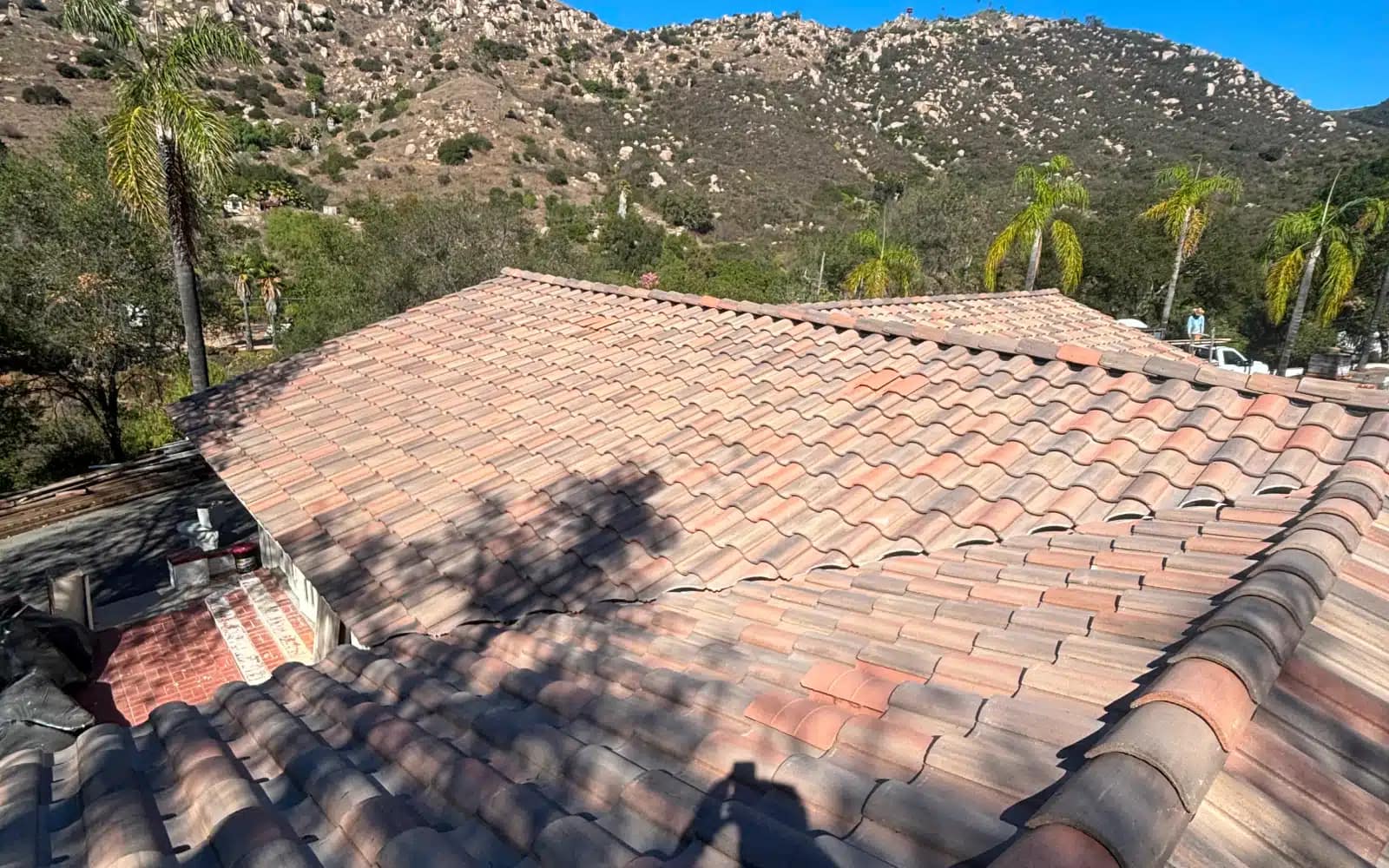 Finished concrete tile roofing system installed across multiple roof sections in San Marcos, CA following full system replacement.