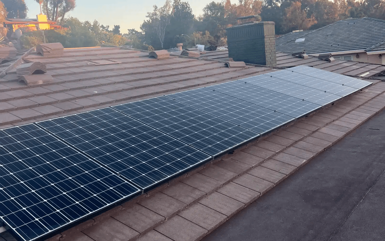 Concrete tile roof valley area in Rancho Bernardo, San Diego, CA showing aging materials and pre-replacement conditions prior to new roofing installation.