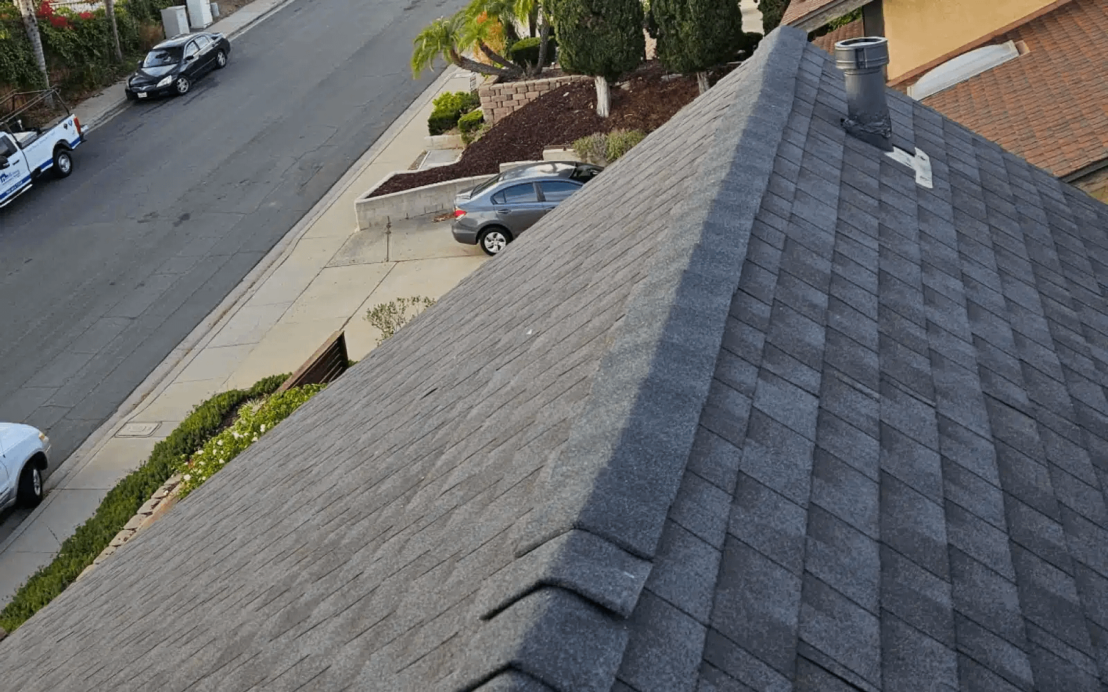 Completed asphalt shingle roof after solar panel reinstallation in Rancho Peñasquitos, California