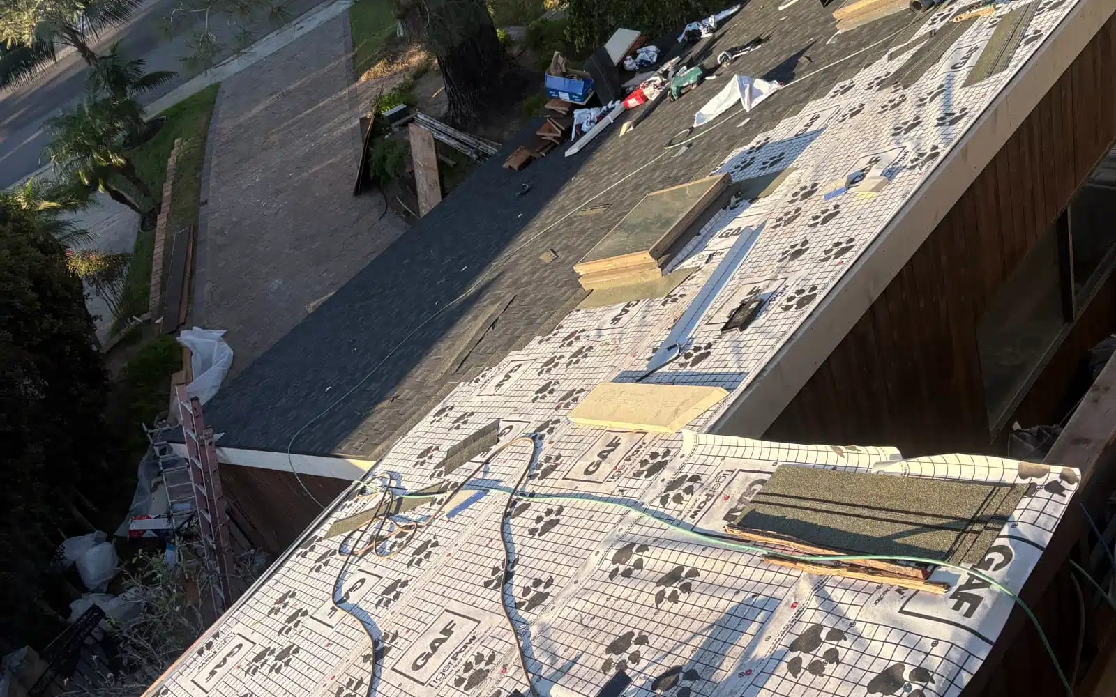 Roof underlayment installed and prepared for asphalt shingle installation during a full roof replacement in Del Mar, California.