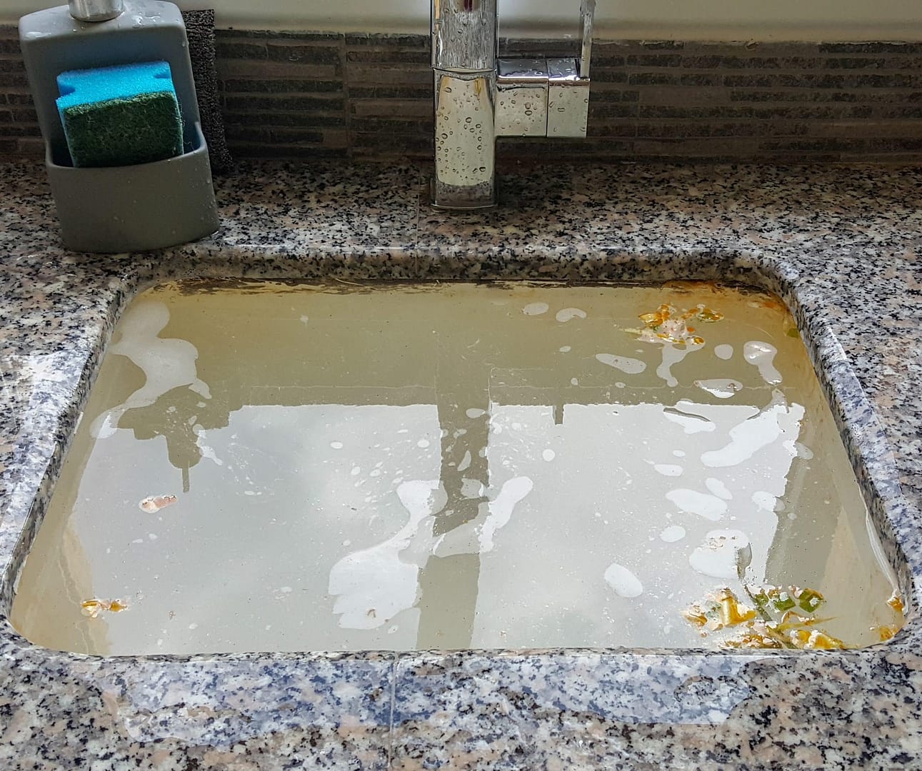 Dirty water pooling in sink due kitchen sink drain backup Dirty water pooling in sink due kitchen sink drain backup