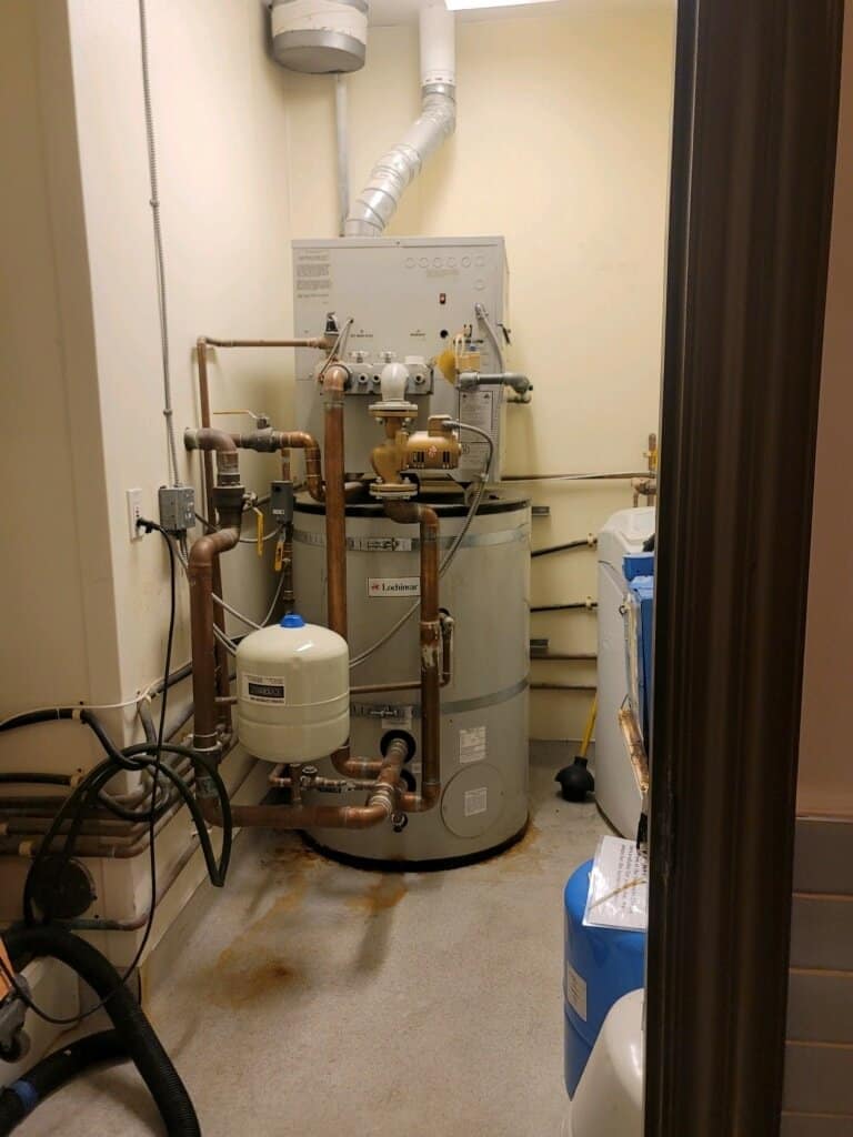 Utility room with water heater equipment Utility room with water heater equipment
